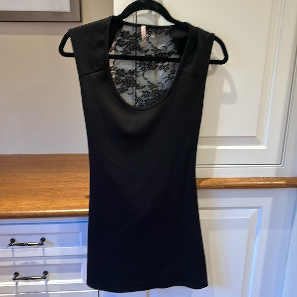 Girls large black dress size Large. Lace and cutout detail in back.